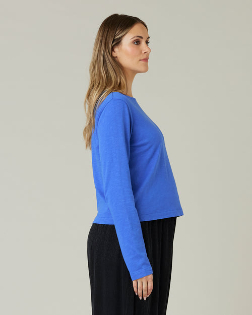 pregnant model wears lapis blue boat neck top