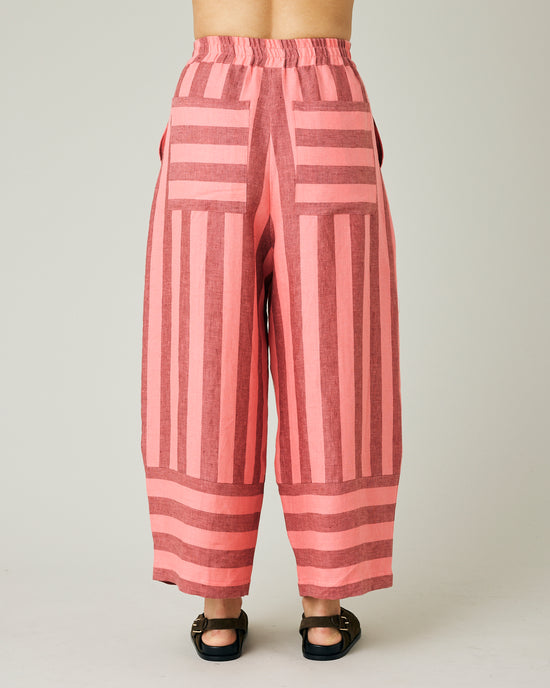 model wears blush stripe bobbi trousers back