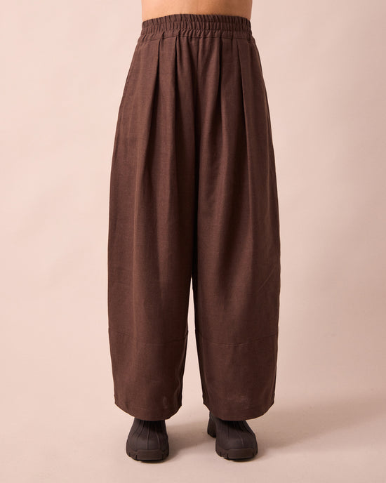 model wears bobbi chocolate linen trousers front