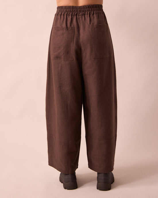 model wears bobbi chocolate linen trousers back