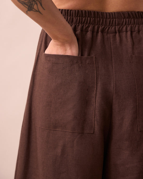 model wears bobbi chocolate linen trousers detail