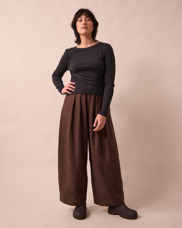 model wears bobbi chocolate linen trousers left