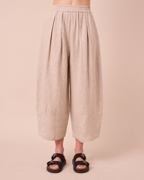 model wears bobbi natural linen trousers front