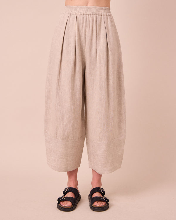 model wears bobbi natural linen trousers front