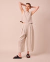 model wears bobbi natural linen trousers right