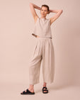 model wears bobbi natural linen trousers right