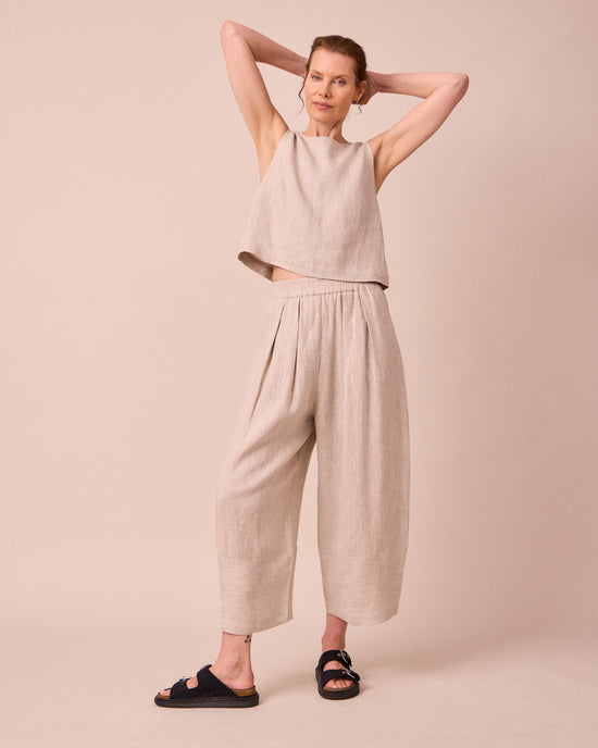 model wears bobbi natural linen trousers right