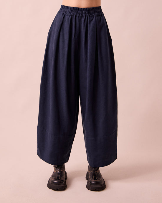 model wears bobbi navy linen trousrs front