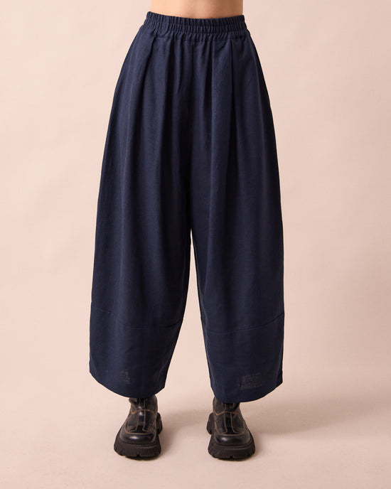 model wears bobbi navy linen trousrs front