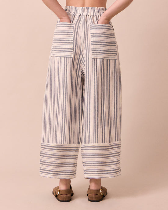 model wears bobbi sailor stripe linen trousers back
