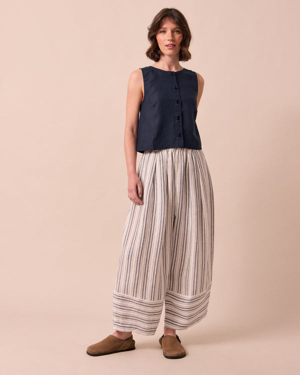 model wears bobbi sailor stripe linen trousers left