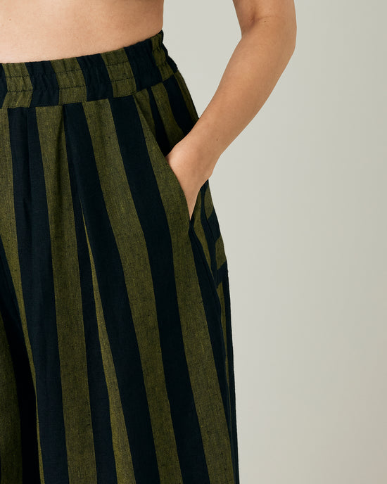 model wears black and olive stripe bobbi trousers