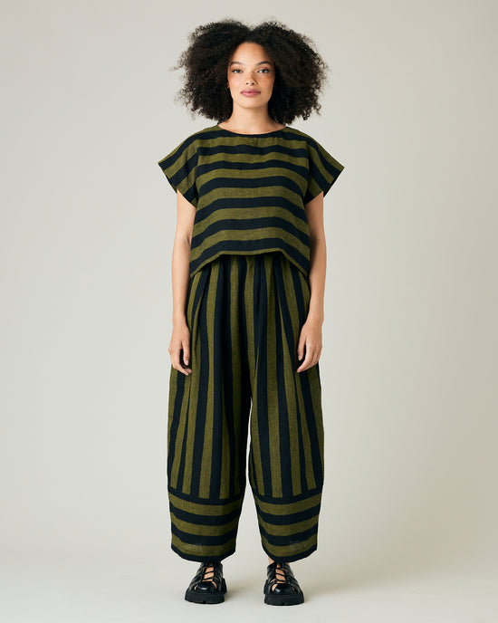 model wears black and olive stripe bobbi trousers