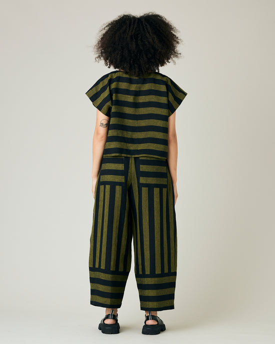 model wears black and olive stripe bobbi trousers