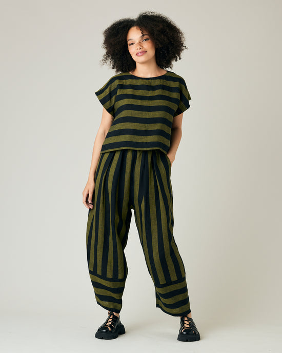 model wears black and olive stripe bobbi trousers