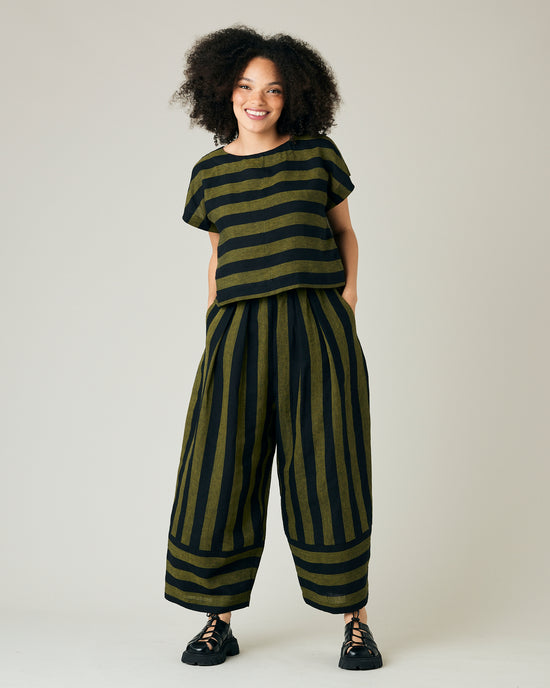 model wears black and olive stripe bobbi trousers