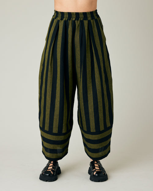 model wears black and olive stripe bobbi trousers front