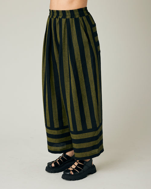 model wears black and olive stripe bobbi trousers left