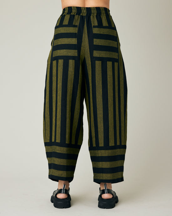 model wears black and olive stripe bobbi trousers back