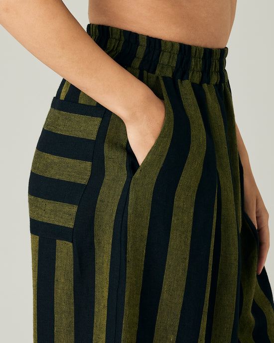 model wears black and olive stripe bobbi trousers