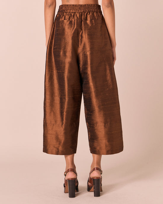 model wears bobbi pecan silk dupion trousers back