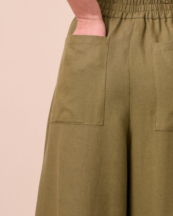 model wears bobbi khaki linen trousers 