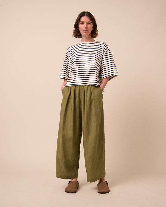model wears bobbi khaki linen trousers right