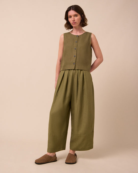 model wears bobbi khaki linen trousers left