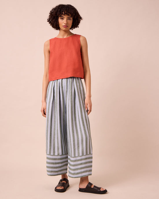 model wears bobbi aloe stripe linen trousers left