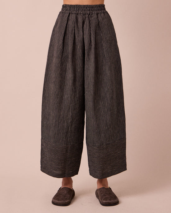 model wears bobbi black and ecru pencil stripe linen trousers front