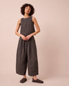model wears bobbi black and ecru pencil stripe linen trousers right