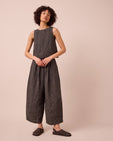 model wears bobbi black and ecru pencil stripe linen trousers right