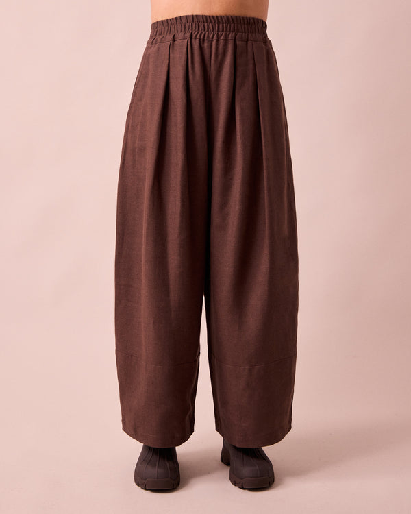 model wears bobbi chocolate linen trousers front