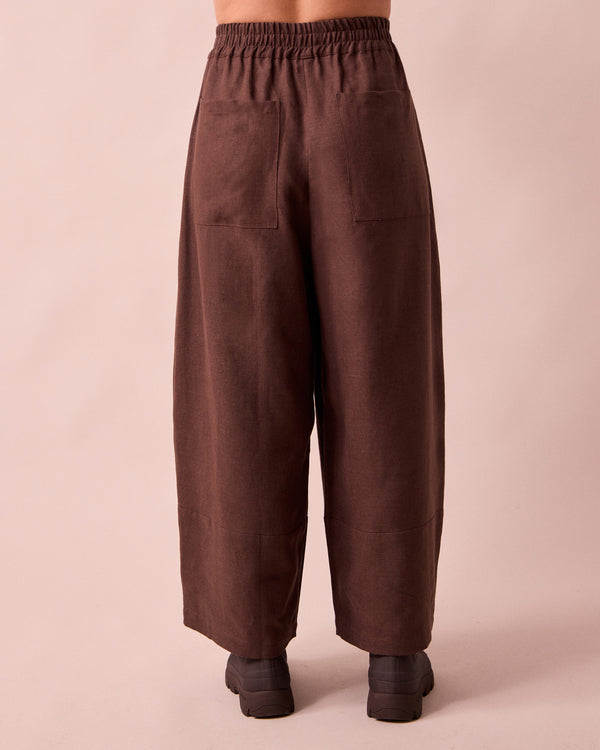 model wears bobbi chocolate linen trousers back