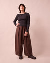model wears bobbi chocolate linen trousers left