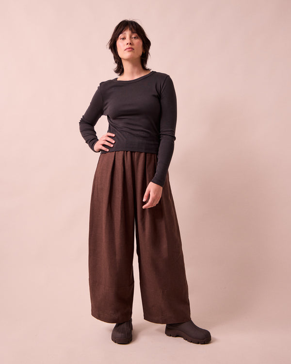 model wears bobbi chocolate linen trousers left