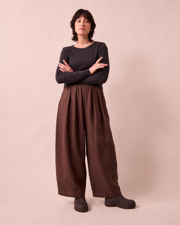model wears bobbi chocolate linen trousers right