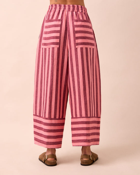 model wears bobbi fiesta pink linen trousers back