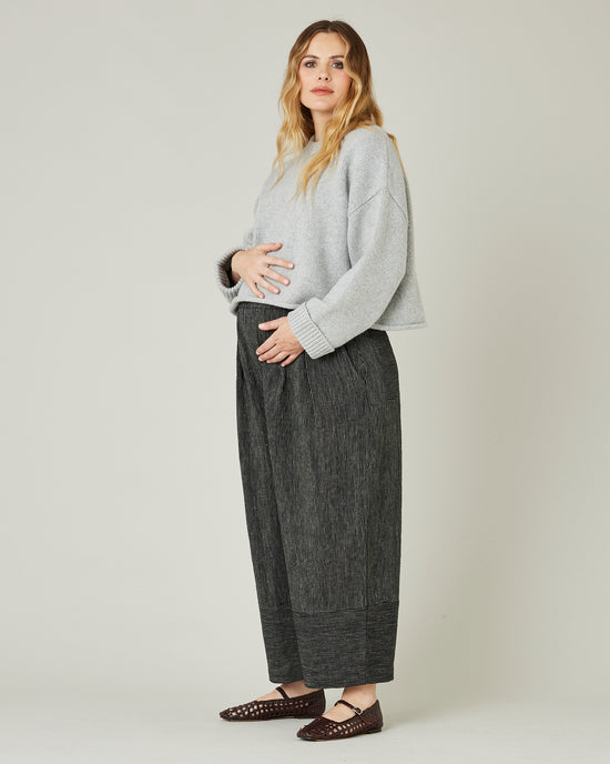 pregnant model wears black and ecru pencil stripe bobbi trousers