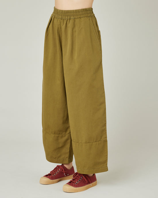 model wears Sicilian green twill bobbi trousers left