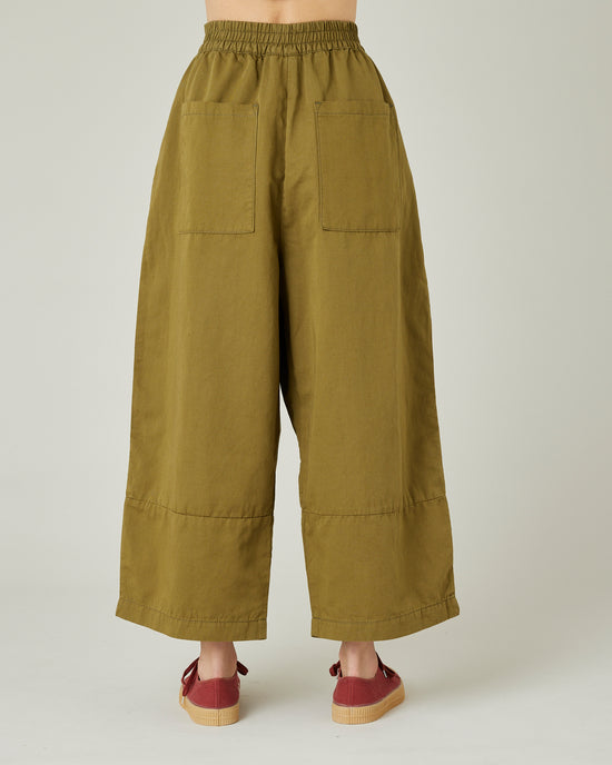 model wears Sicilian green twill bobbi trousers back