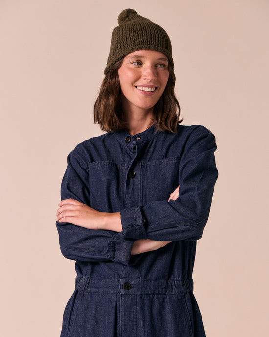 model wears the dark forest knitted bobble hat