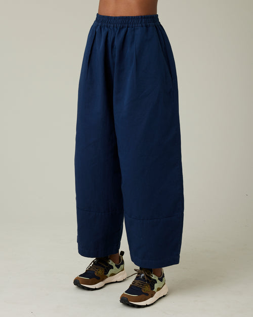 model wears navy twill bobbi trousers left