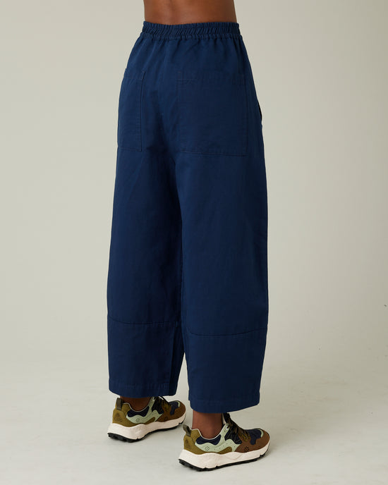 model wears navy twill bobbi trousers right