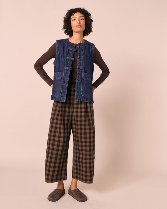 model wears bonnie chestnut check denim jeans left