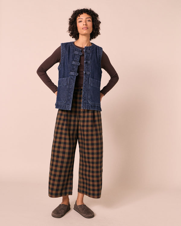 model wears bonnie chestnut check denim jeans left