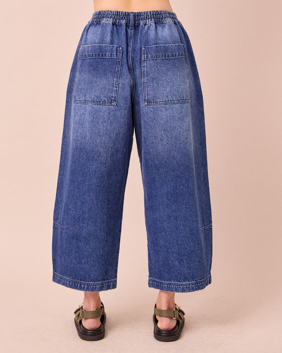 model wears bonnie mid blue denim jeans back