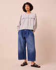 model wears bonnie mid blue denim jeans left