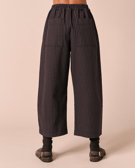 model wears bonnie mulberry gingham denim jeans back