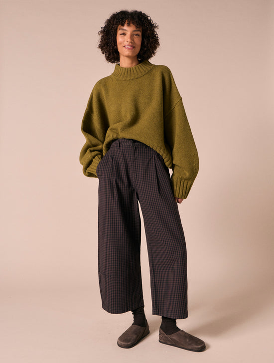 model wears bonnie mulberry gingham  denim jeans left